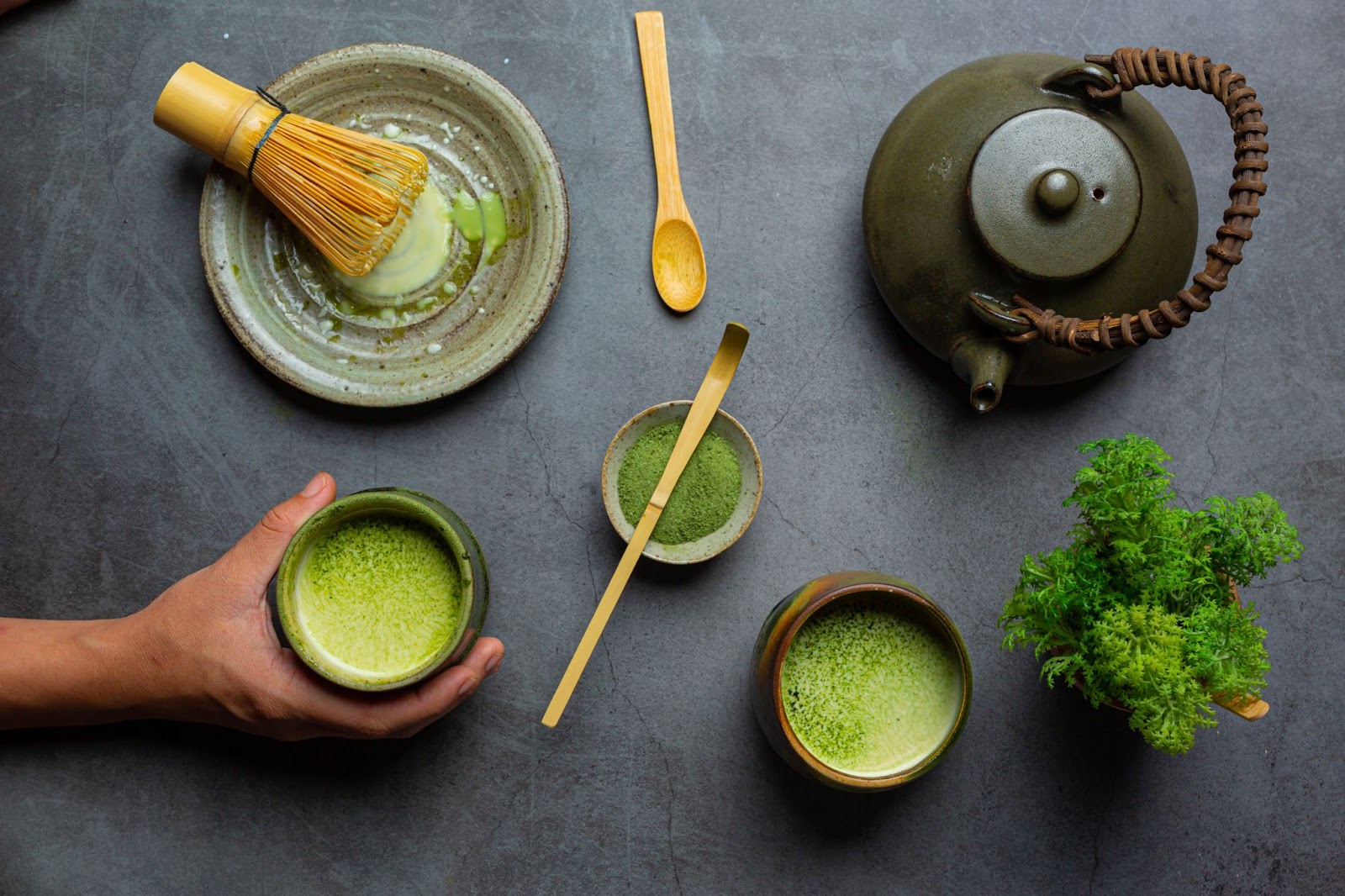 hot green tea glass with cream topped with green tea decorated with green tea powder (1)