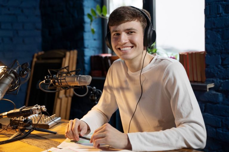 man with microphone headphones running podcast studio