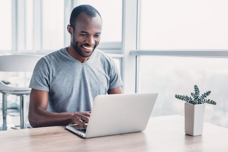 happy man using his laptop