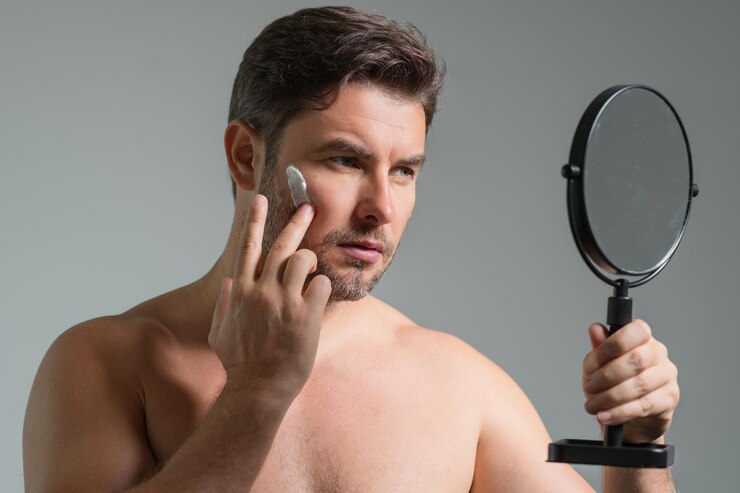 man applying face cream beauty routine man with perfect skin antiaging wrinkle cream concept 265223 103374